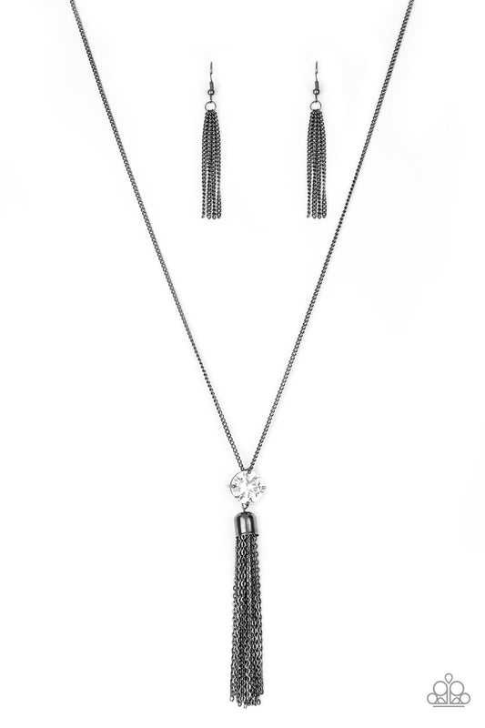 Shimmery bling necklace with large dangling tassel on the end. 