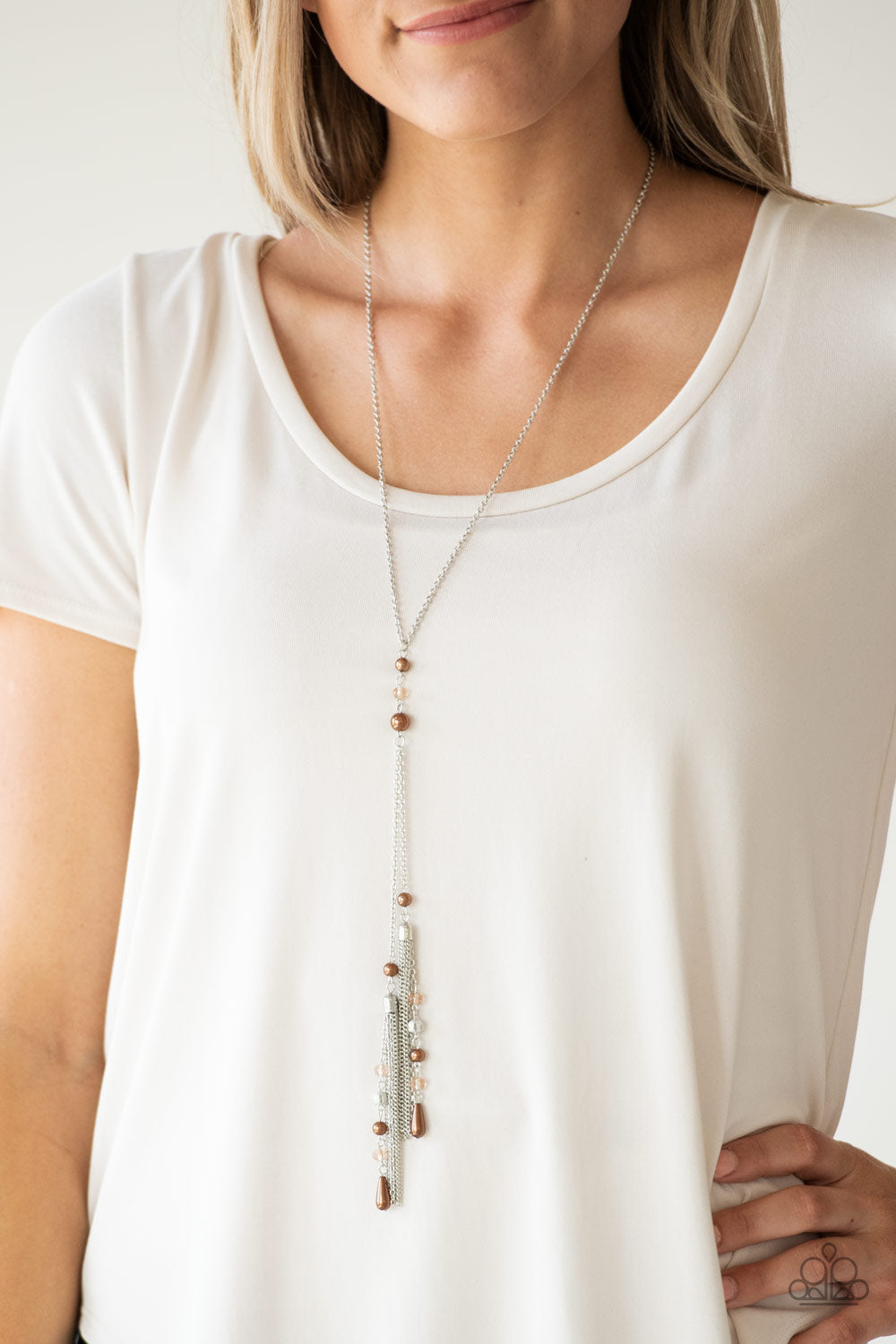 Paparazzi Necklace - Dainty brown pearls and sparkling brown crystal-like beads give way to two shimmery silver chain tassels. Infused with ornate silver beads, strands of matching beads trickle down the tassels for a refined fla