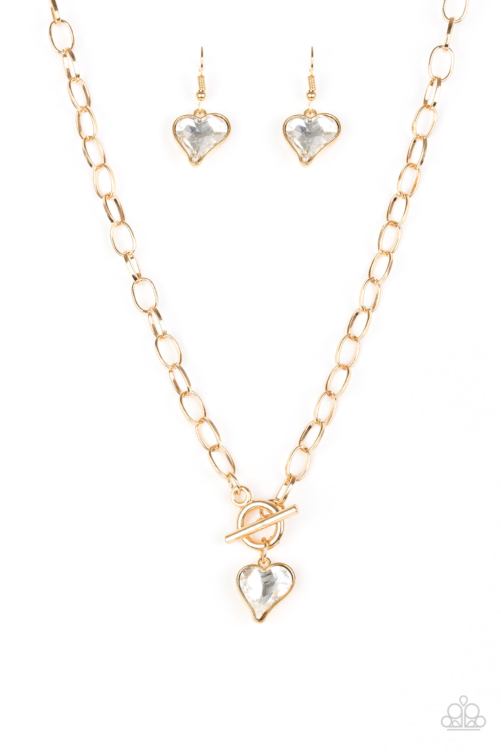 Paparazzi Accessories necklace, new gold, cut into a whimsical heart shape, a glittery white gem swings from the bottom of a glistening gold chain below the collar for a charming look. Features a toggle closure.