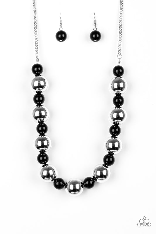 aparazzi Accessories black and silver beaded necklace. Polished black beads and dramatic silver beads drape below the collar for a perfect pop of color. Features an adjustable clasp closure.  Paparazzi Accessories are nickel-free and lead free.