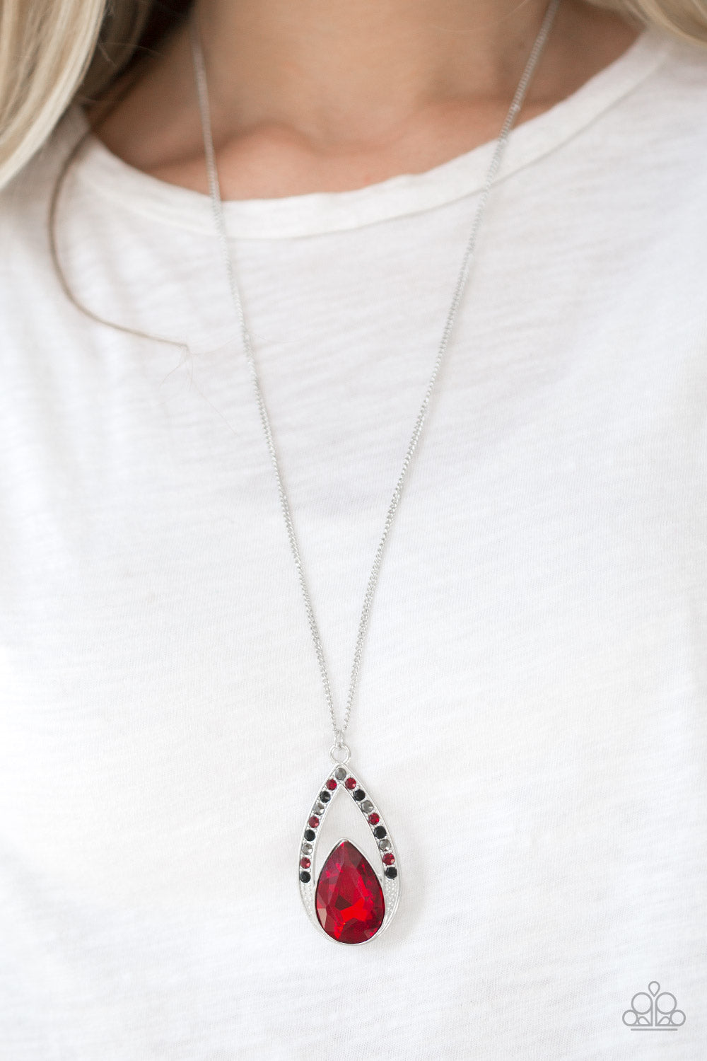 Paparazzi Accessories Necklace - A fiery red teardrop gem is pressed into a silver frame radiating with black, hematite, and red rhinestones. 