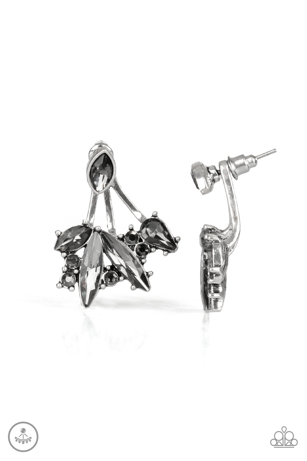 A solitaire smoky marquise cut rhinestone attaches to a double-sided post, designed to fasten behind the ear. Encrusted in a collision of mismatched smoky and hematite rhinestones, a double-sided post peeks out beneath the ear, creating a glittery fringe. Earring attaches to a standard post fitting.