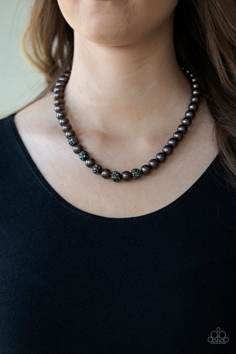 Paparazzi Accessories- Infused with glittery hematite rhinestone encrusted beads, a strand of pearly gunmetal beads drapes below the collar in a timeless fashion. Features an adjustable clasp closure.