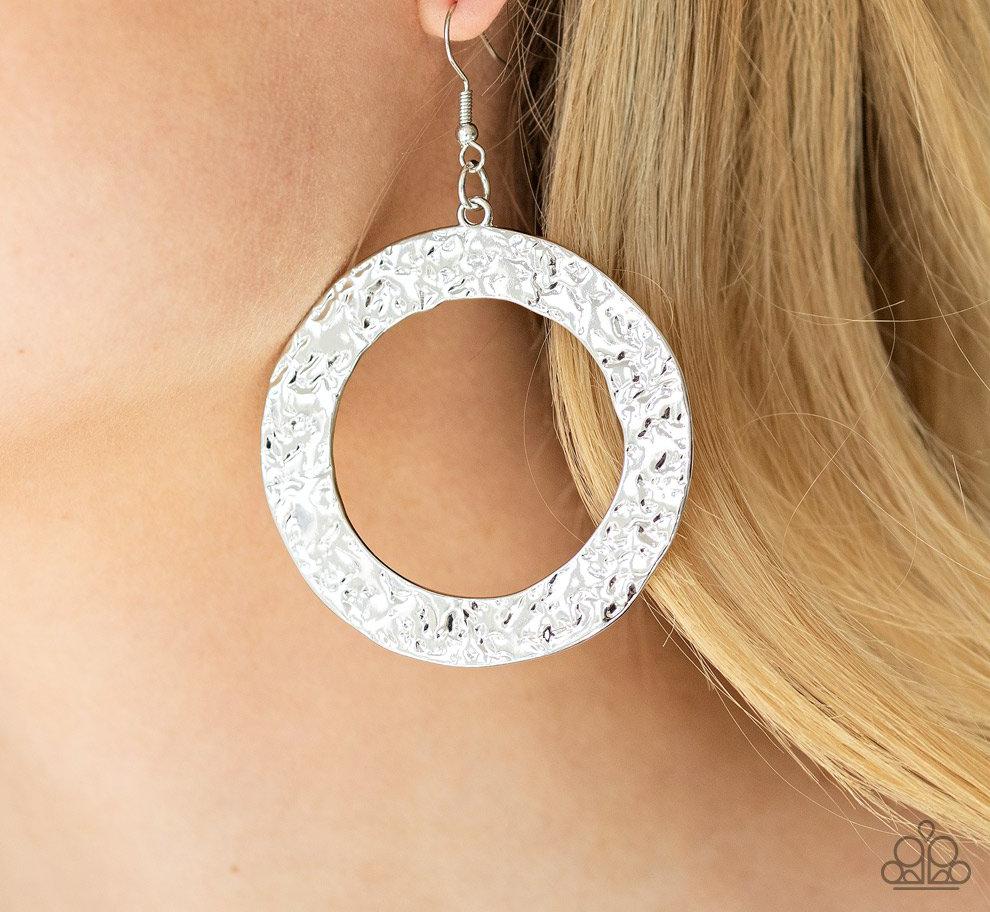 Paparazzi Silver Earrings, A brushed in a rustic silver finish, a flat circular frame has been hammered in blinding detail for a handcrafted look.
