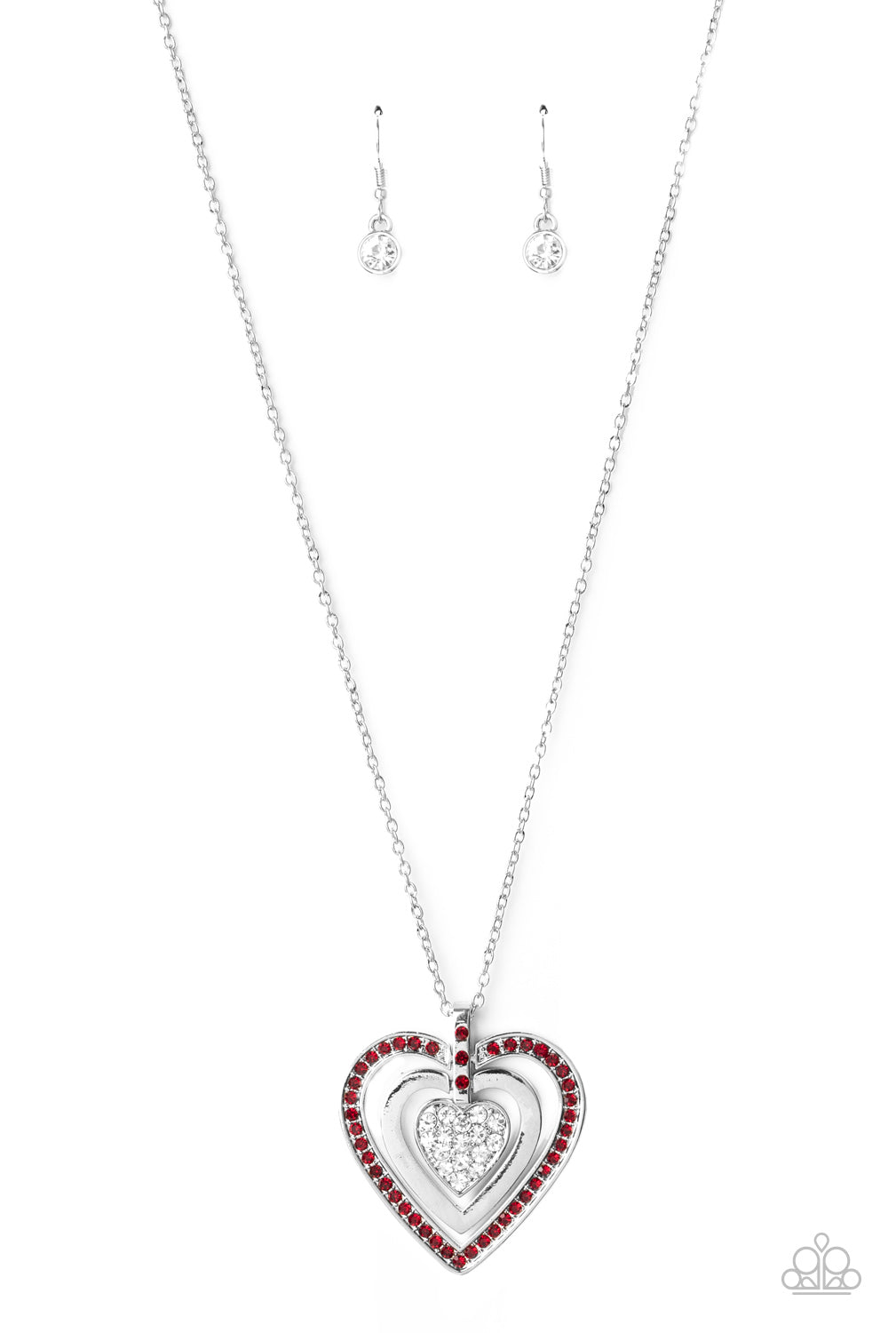 A red rhinestone encrusted heart, shiny silver heart, and glittery white rhinestone encrusted heart swings from the bottom of a red rhinestone dotted fitting, creating a romantically oversized pendant below the collar. 