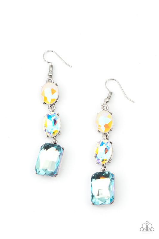 Paparazzi Accessories, A blue emerald style gem swings from the bottom of a mismatched pair of iridescent and milky opalescent oval rhinestones,.