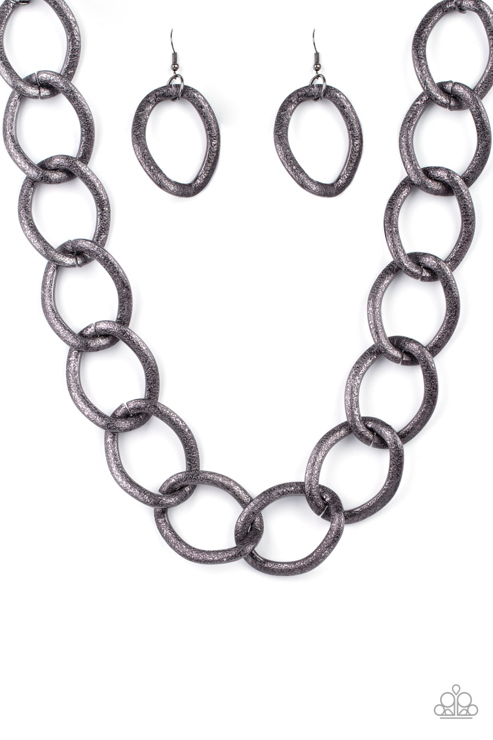 Surprisingly lightweight, enormous hematite links create an intimidating statement as they circle around the collar. The contoured, textured links have a distinctly industrial vibe that demands a second look. Features an adjustable clasp closure.  Paparazzi Accessories are nickel and lead free and all necklaces includes a pair of earrings.  Sold as one individual necklace. Includes one pair of matching earrings.