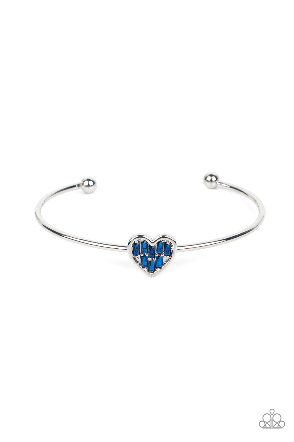A studded silver heart is encrusted in emerald cut blue rhinestones, creating a flirtatious centerpiece atop a dainty silver cuff.