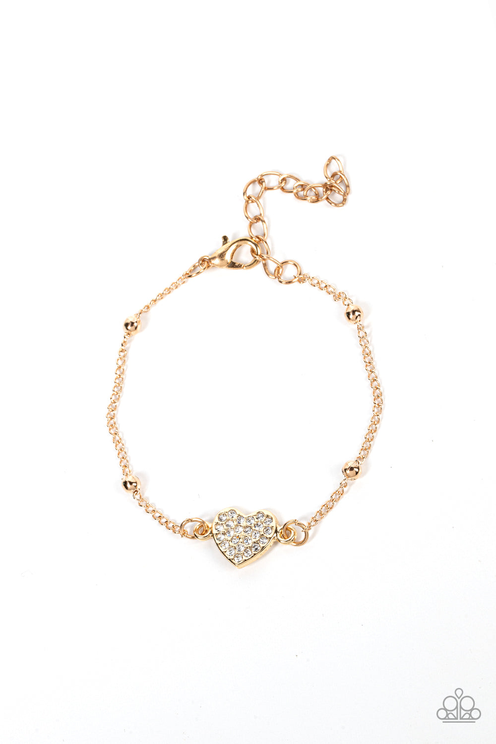 A white rhinestone dotted gold heart charm adorns a gold beaded chain, creating a romantic centerpiece. Features an adjustable clasp closure.