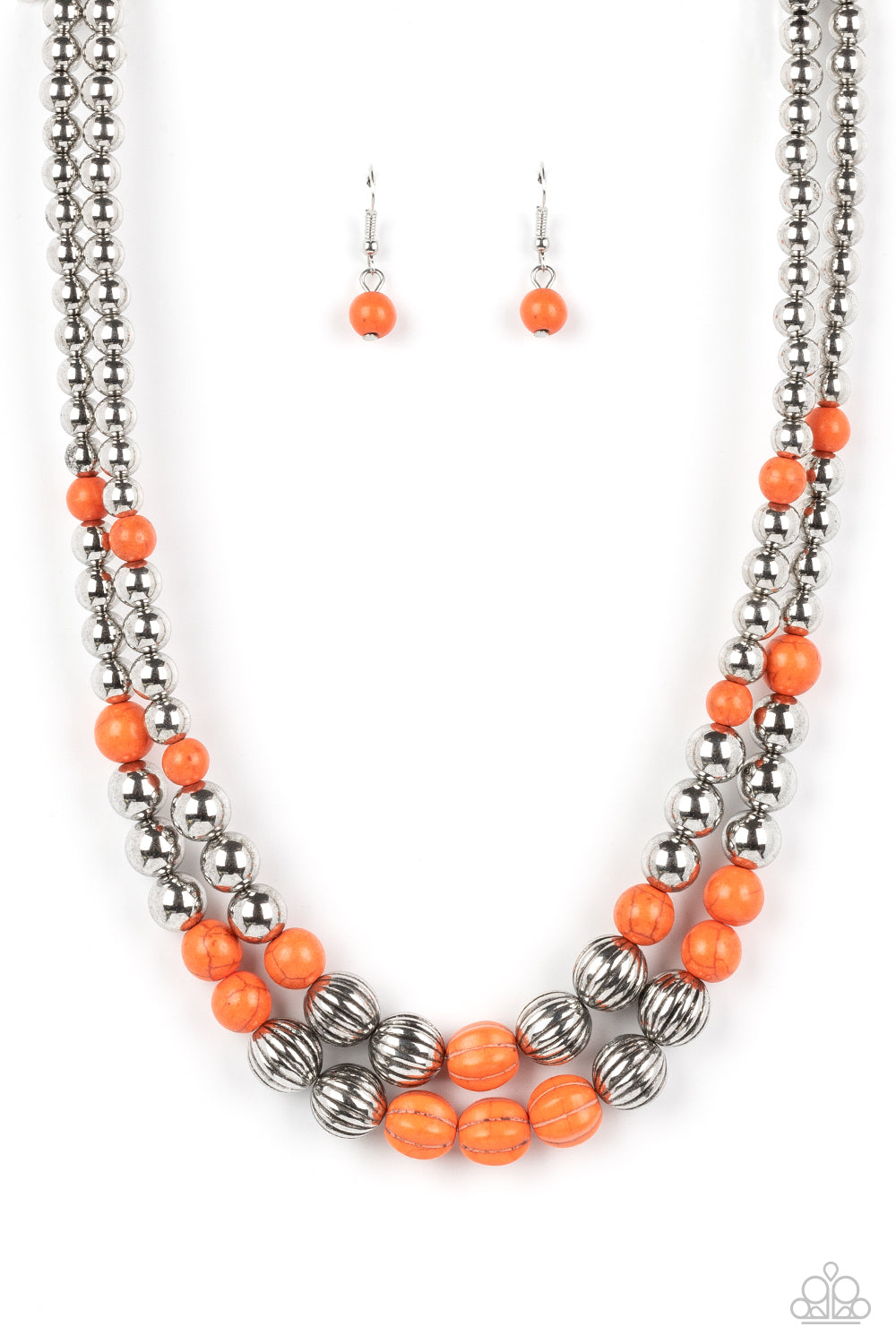 Gradually increasing in size, a refreshing series of shiny silver beads, orange stones, and faux orange stone accents